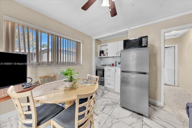 dining room featuring ceiling fan