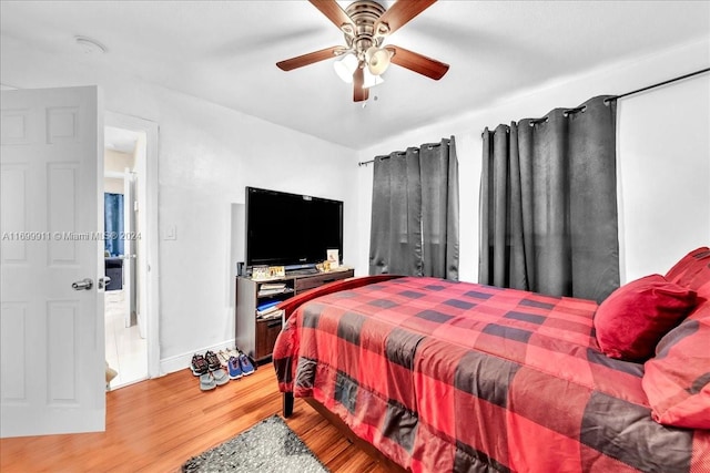 bedroom with ceiling fan and wood-type flooring