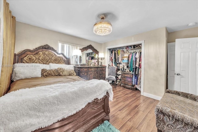 bedroom featuring a closet and light hardwood / wood-style flooring