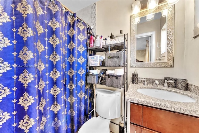 bathroom with vanity and toilet