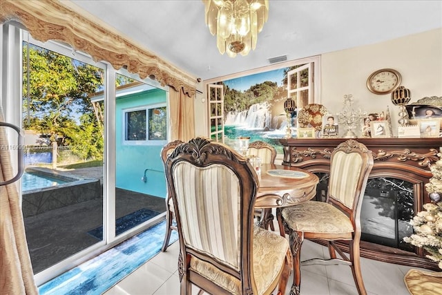 6733 SW 27th Ct, Miramar, FL 33023 - dining space with tile patterned floors, plenty of natural light, and a chandelier