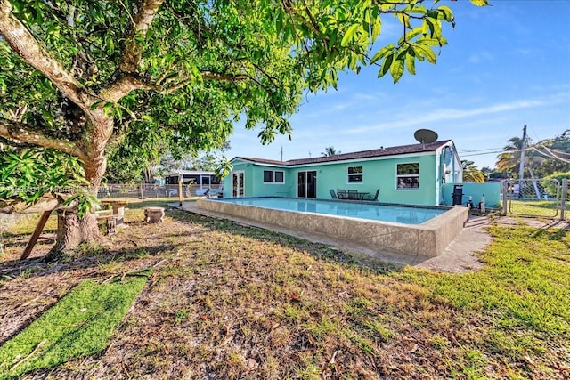 6733 SW 27th Ct, Miramar, FL 33023 - back of house with a fenced backyard, a gate, and stucco siding