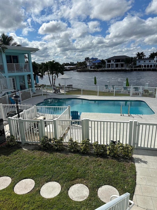 view of pool with a water view