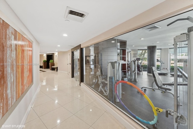 corridor with light tile patterned floors