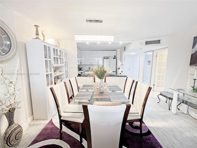 dining room with light hardwood / wood-style floors