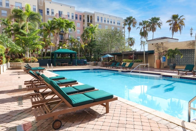 view of swimming pool with a gazebo and a patio area