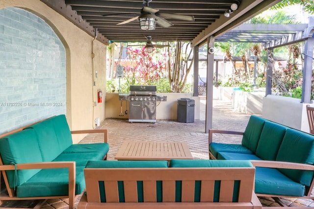 view of patio with ceiling fan, area for grilling, an outdoor hangout area, and a pergola