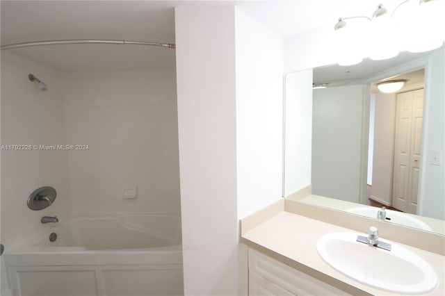 bathroom featuring vanity and tiled shower / bath combo