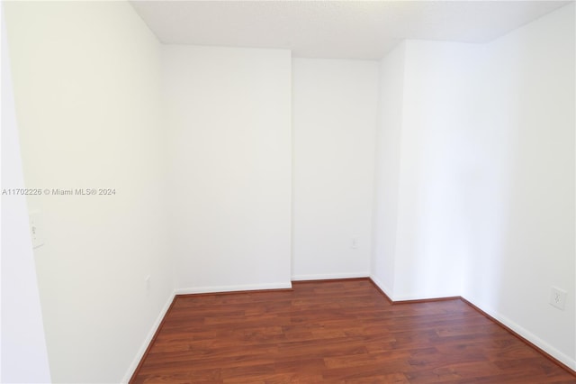 empty room featuring dark hardwood / wood-style floors