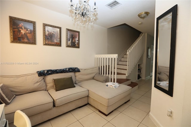 living room with light tile patterned floors and a notable chandelier