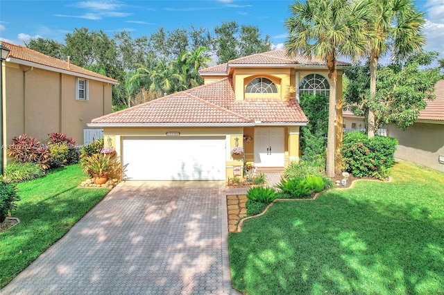 mediterranean / spanish-style home with a garage and a front lawn