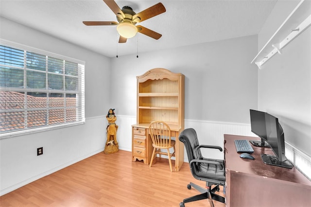 office area featuring ceiling fan, a textured ceiling, and light wood-type flooring