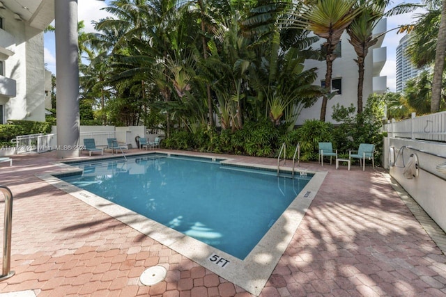 view of swimming pool featuring a patio