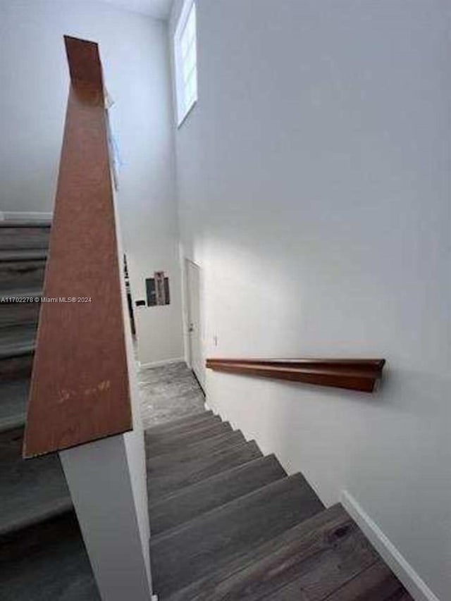 stairs featuring wood-type flooring