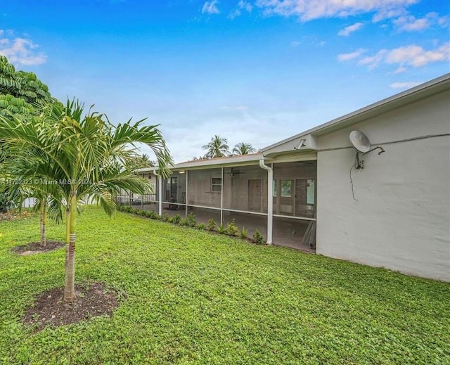 view of yard with a sunroom