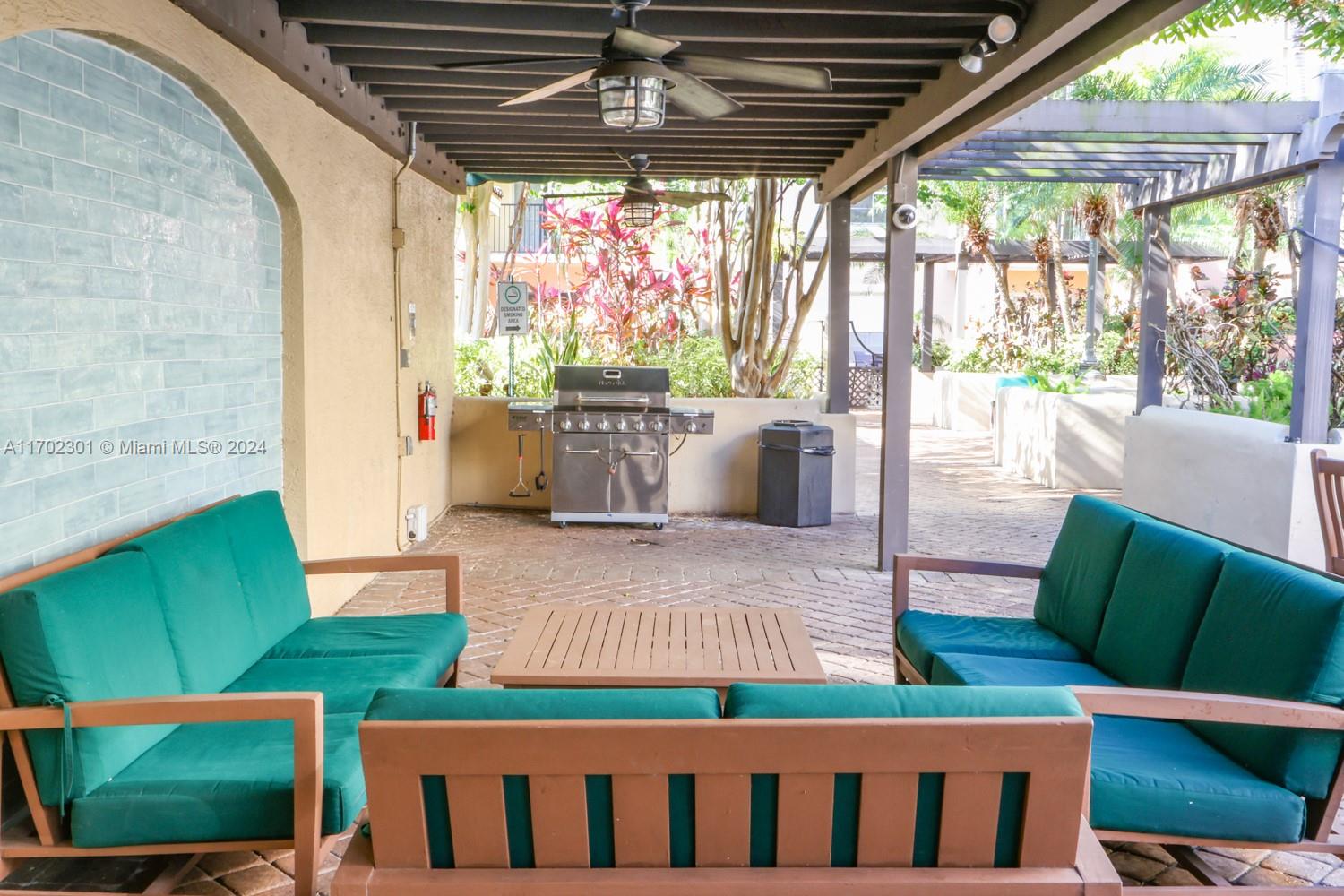 view of patio / terrace featuring outdoor lounge area, ceiling fan, a pergola, and grilling area