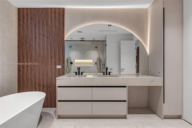 bathroom featuring separate shower and tub and vanity