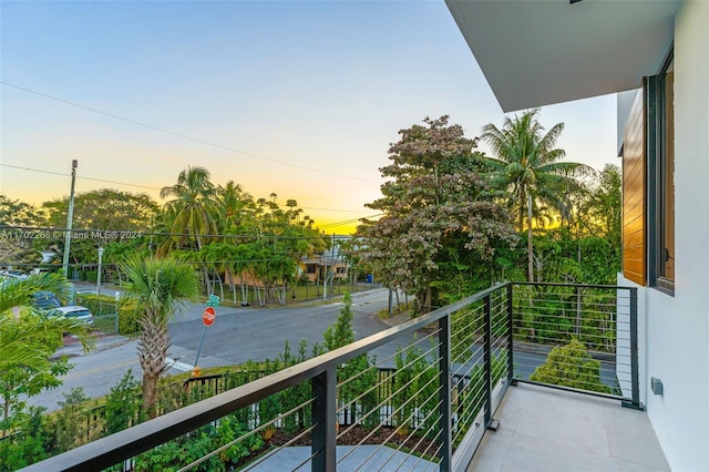 view of balcony at dusk