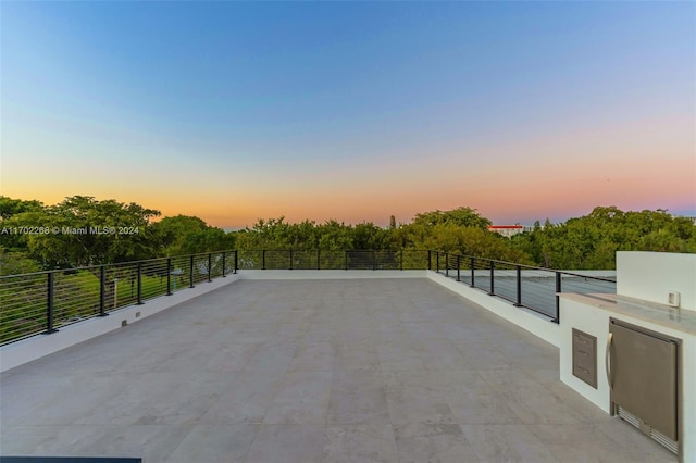 view of patio terrace at dusk