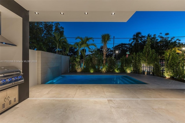 pool at dusk featuring a patio