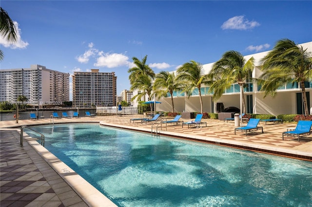 view of swimming pool featuring a patio area