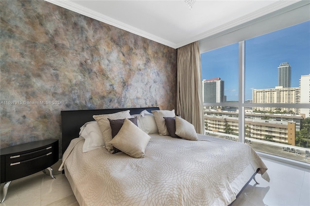 bedroom featuring light tile patterned floors and crown molding