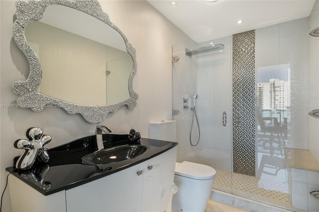 bathroom with tile patterned floors, vanity, toilet, and an enclosed shower