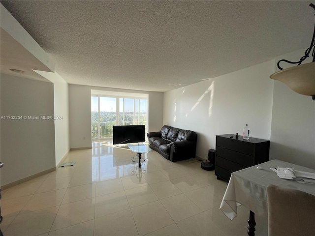 tiled living room with a textured ceiling