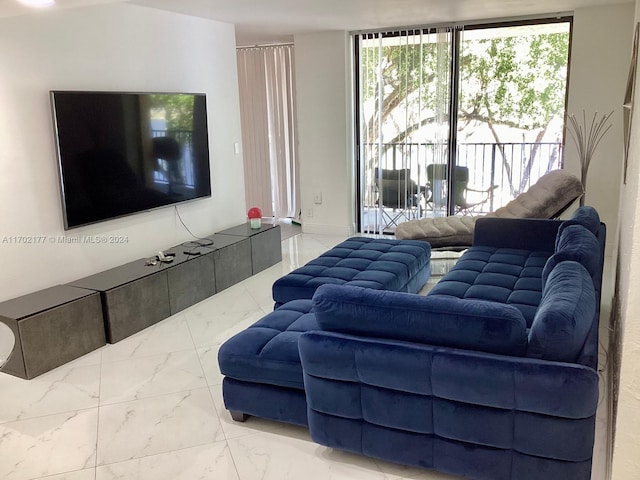 living room with floor to ceiling windows