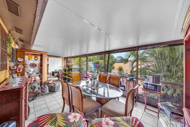 sunroom featuring vaulted ceiling