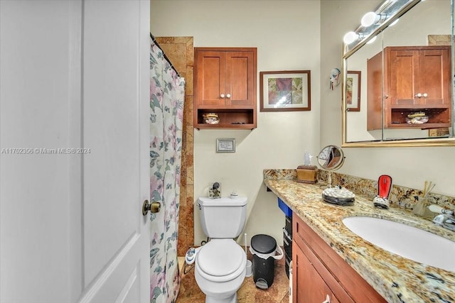 bathroom featuring tile patterned floors, walk in shower, vanity, and toilet