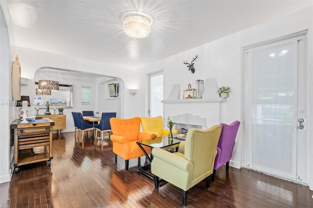 living room featuring hardwood / wood-style floors and an inviting chandelier