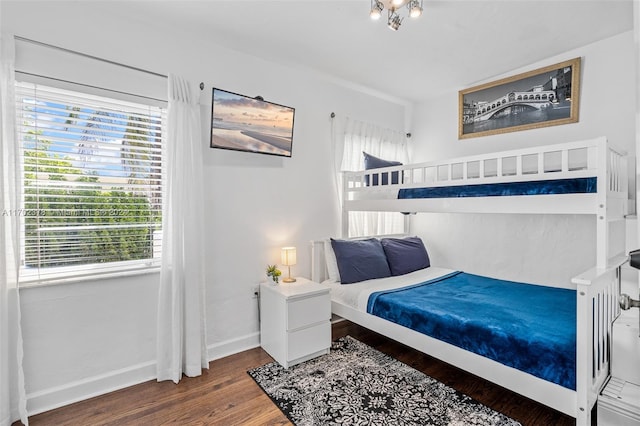 bedroom with hardwood / wood-style floors