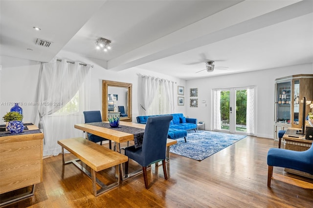 dining room featuring ceiling fan, hardwood / wood-style floors, and french doors