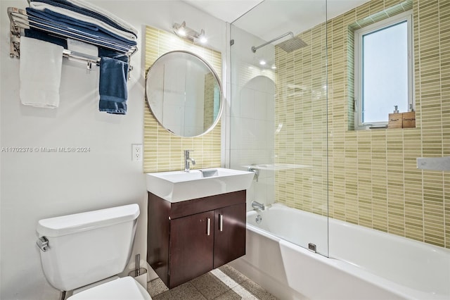 full bathroom featuring vanity, toilet, and bath / shower combo with glass door