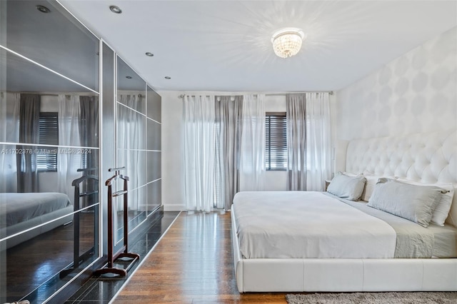 bedroom featuring dark hardwood / wood-style flooring