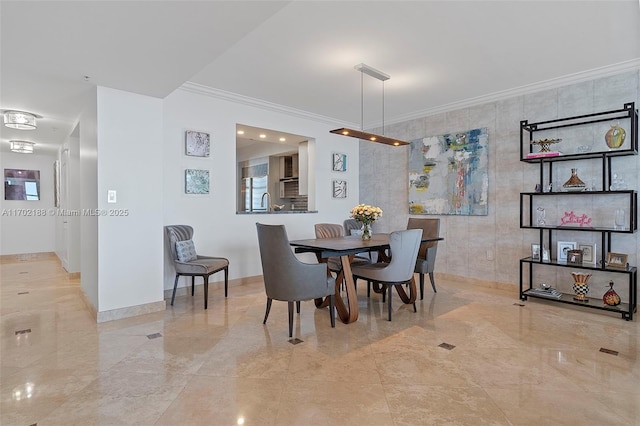 dining room featuring crown molding