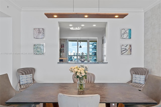 dining room featuring ornamental molding