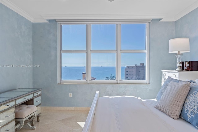 bedroom with ornamental molding and a water view