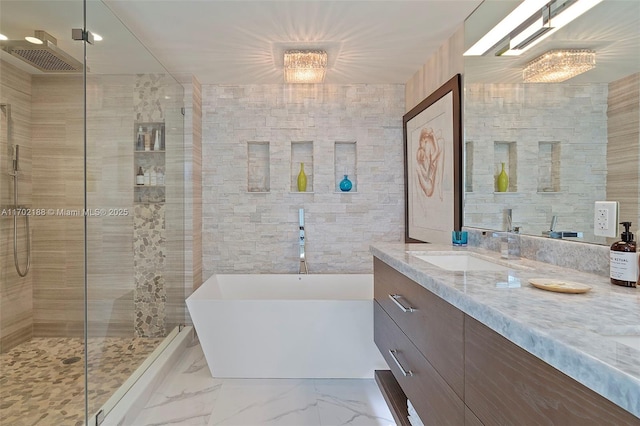 bathroom with vanity, plus walk in shower, and tile walls