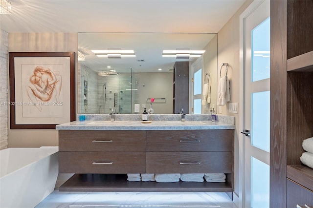 bathroom featuring vanity and shower with separate bathtub