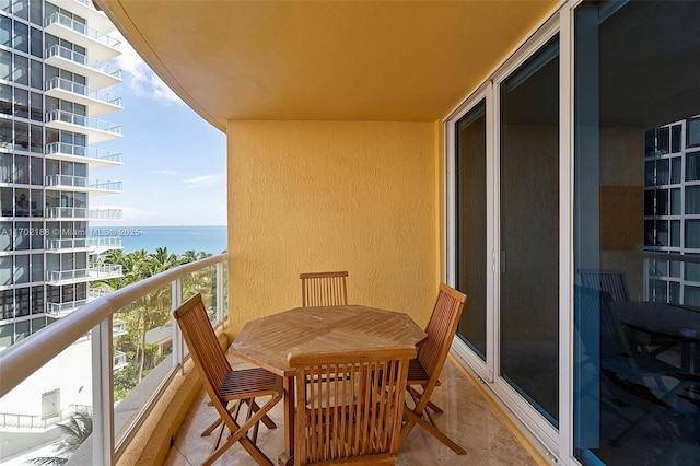 balcony featuring a water view