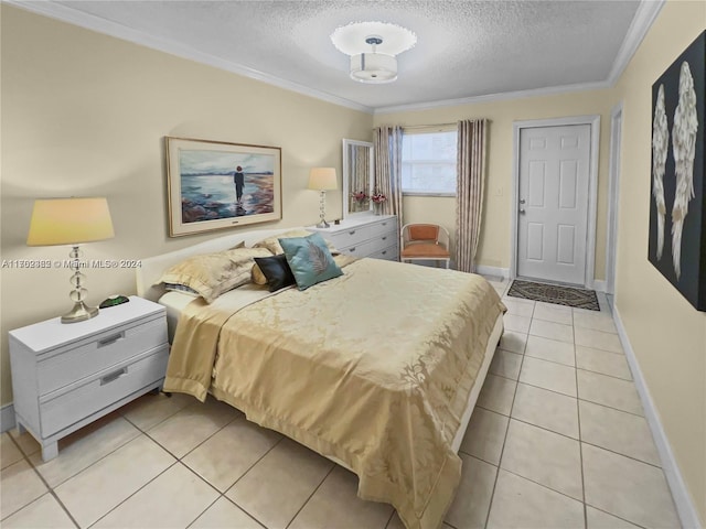 tiled bedroom with ornamental molding and a textured ceiling