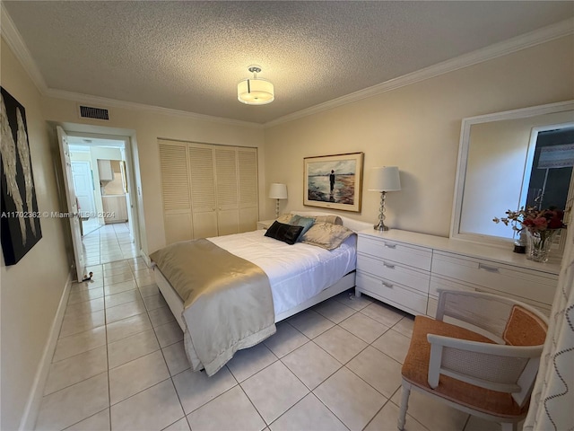 tiled bedroom with a textured ceiling, a closet, and crown molding