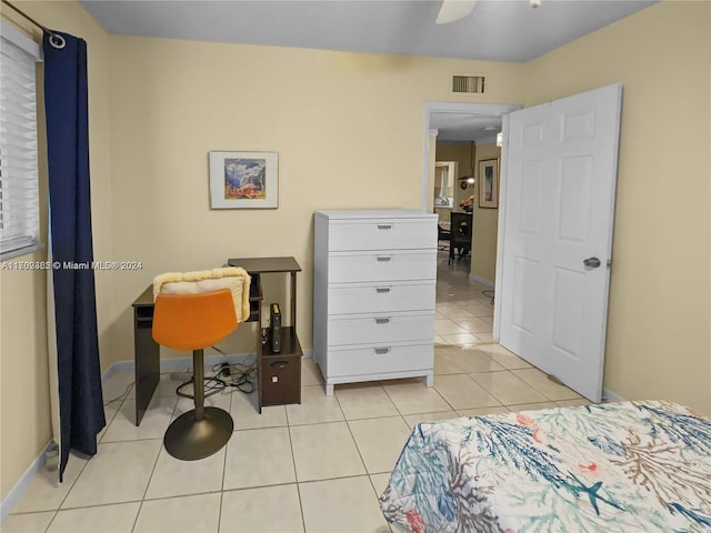 bedroom featuring ceiling fan and light tile patterned flooring