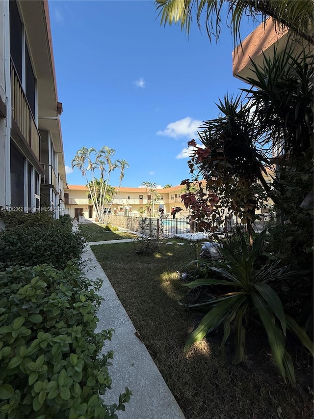 view of home's community with a lawn