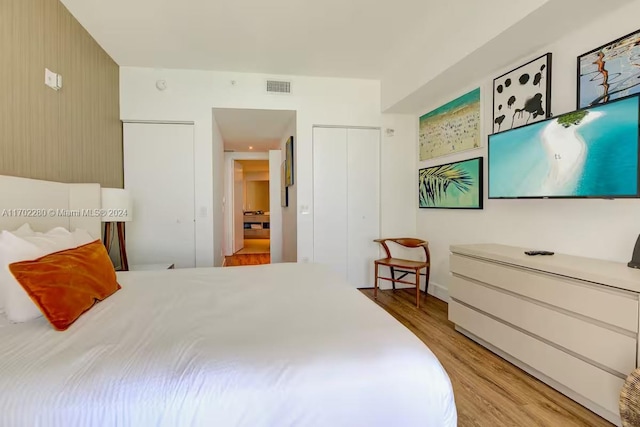 bedroom featuring light hardwood / wood-style floors and a closet