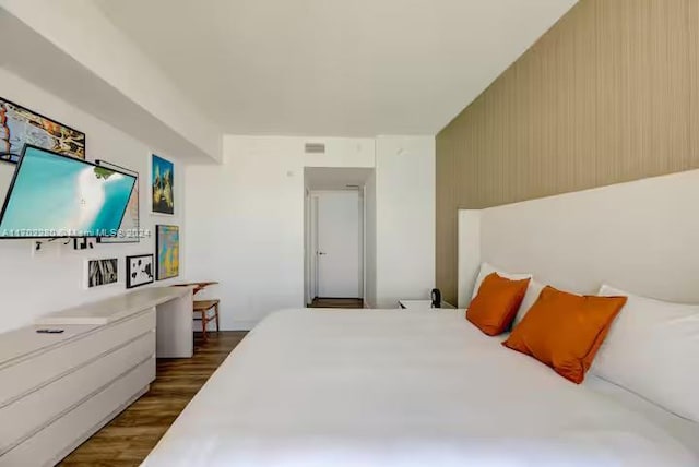 bedroom featuring dark hardwood / wood-style floors