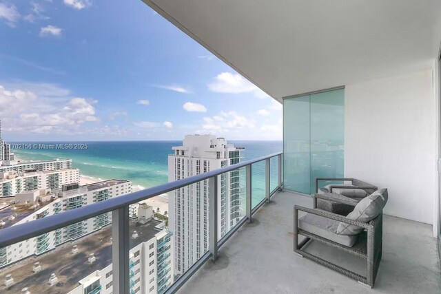 balcony featuring a water view