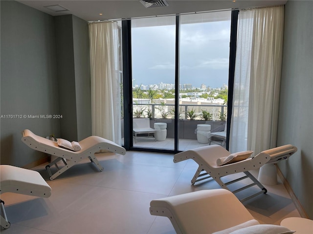 sitting room with a wall of windows